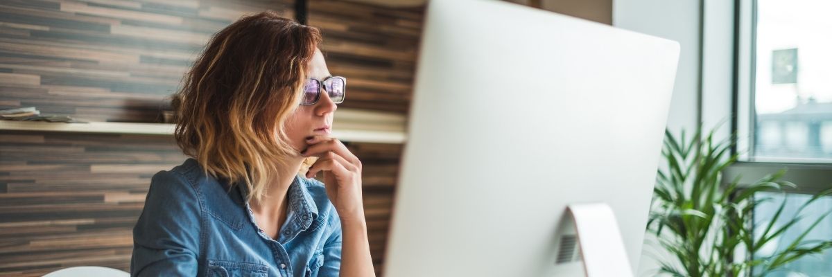 woman looking on computer considering what clear aligners to buy