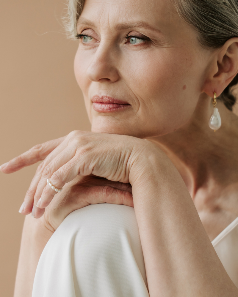 An older woman considering Smiles Club clear aligners.