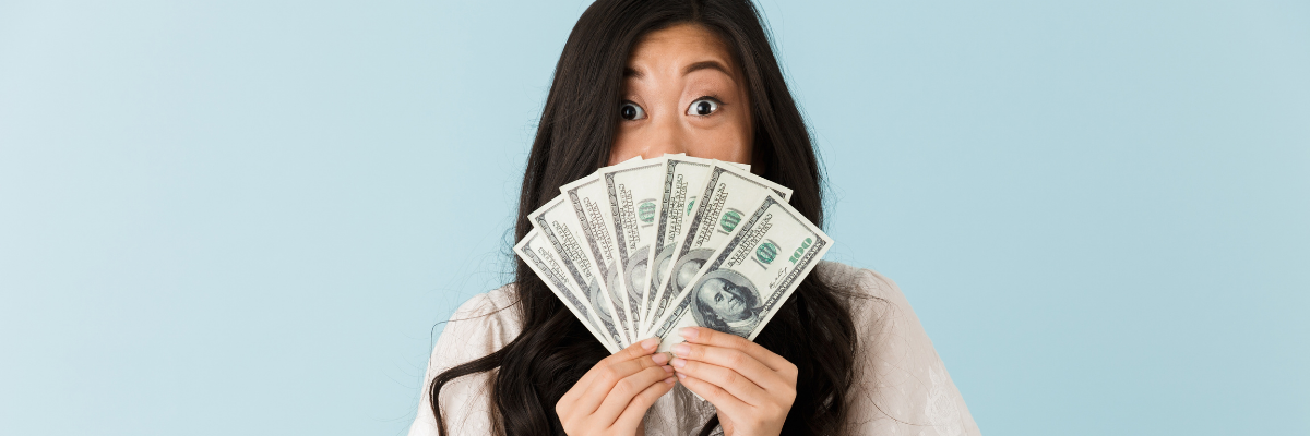 A young lady with money choosing what clear aligners to buy.