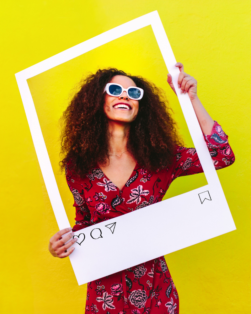 A happy woman posing for pictures with straight smiles club teeth.