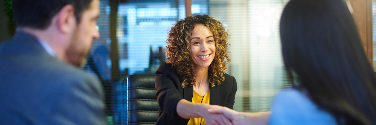 A woman with straight teeth at a job interview.